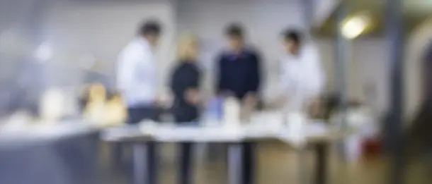 Defocused shot of architect explaining project plan to clients Architects and Customer in the Office.